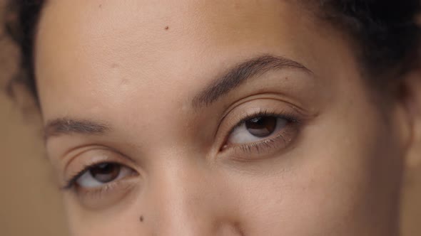 Brown Female Eyes Look Straight Ahead Seriously