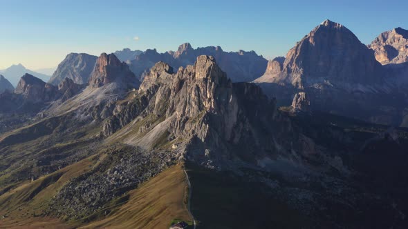 Drone Shot of Lush Trees with Beautiful Mountain Range Background in Dolomites