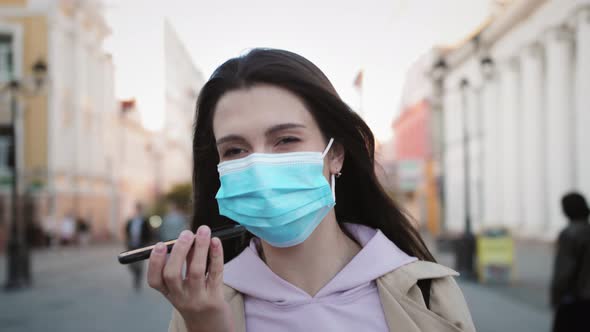 Woman Tourist Voice Recognition Ai Sending Audio Message on Cellphone Phone at Night City Street