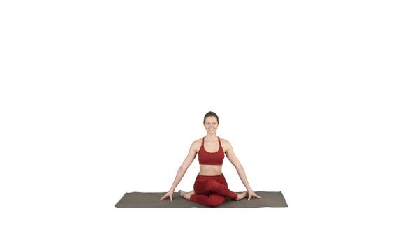 Young Attractive Woman Practicing Yoga Sitting in Gomukasana
