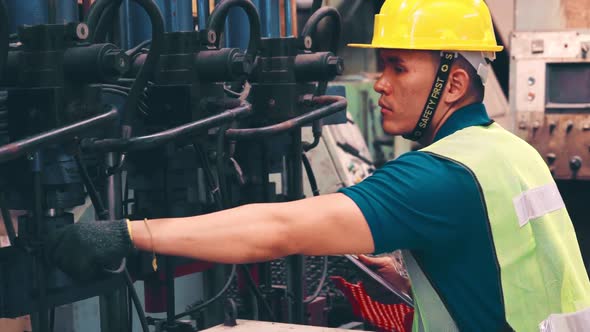 Smart Factory Worker Using Machine in Factory Workshop