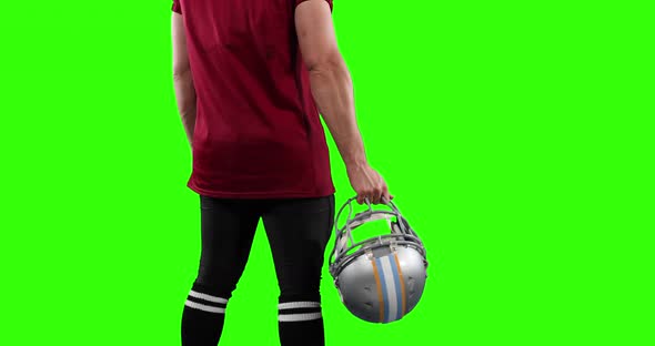 American football player on green screen background.