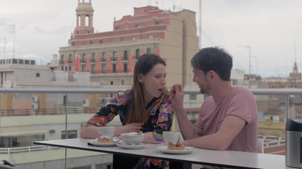 A Couple Enjoying Coffee and Desserts in a Rooftop Cafe in Valencia