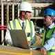 Mature men using laptop on construction site - VideoHive Item for Sale