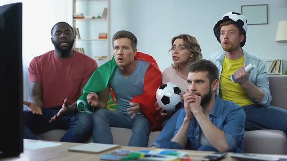 Multiethnic Portugal Fans Watching Match at Home, Celebrating Goal Together