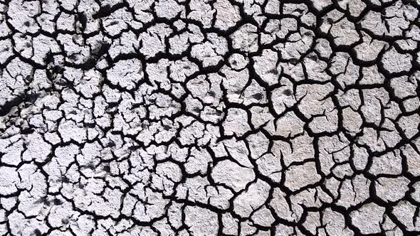 Vertical orientation video: Dried up lake. Cracked soil ground of dried lake or river