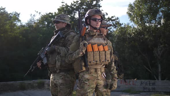 Portrait of Army Soldiers with Weapons in Uniform alt