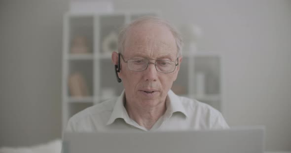 Portrait of Retiree Man Is Chatting Online By Video Call on Laptop, Stay Home at Pandemic of