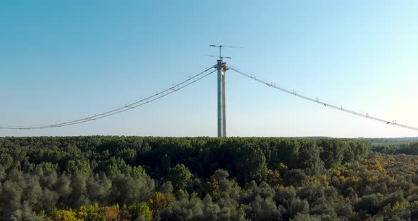 Construction Of Braila Bridge By The Forested Bank Of Danube River In Vadeni, Romania. wide drone