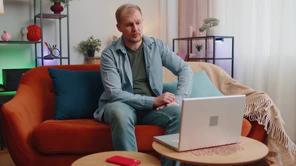 Busy Man Worker Manager Consulting Client Online By Laptop Using Webcam of Notebook at Home Office