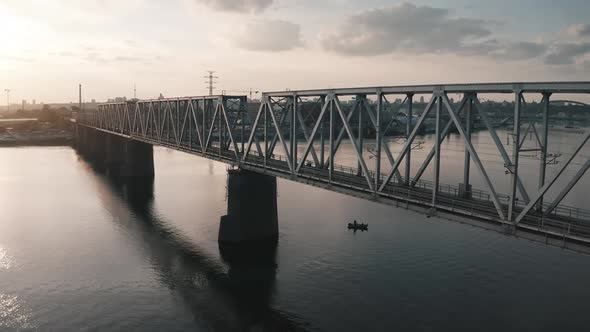 Railway Train Bridge and City River Aerial View