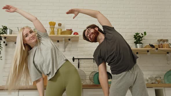 European Man and Woman Practicing Yoga and Caring About Their Wellbeing During the Pandemic