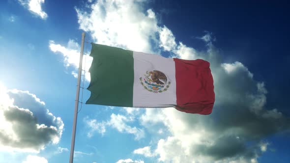 Flag of Mexico Waving at Wind Against Beautiful Blue Sky