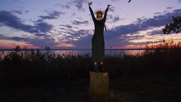 Happy Young Woman in Halloween Costume and Makeup Dances in Nature During Sunset Mystical Footage