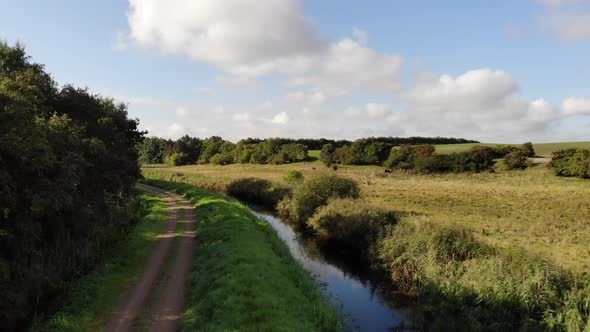 Aerial view of fields with watercourse close to Sejerøbugten in Odsherred.