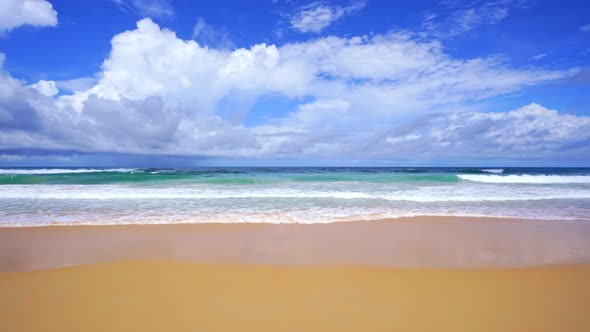 Phuket beach of ocean waves crashing against an empty sand beach