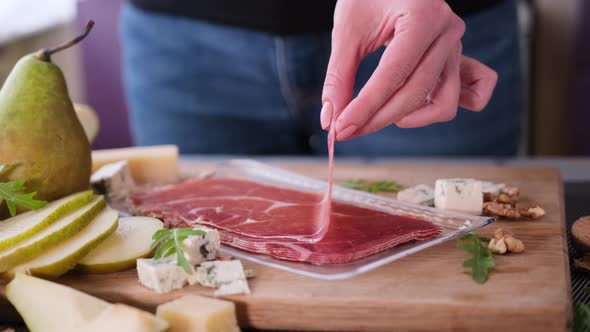 Making Pear and Blue Cheese Salad  Slices of Jamon