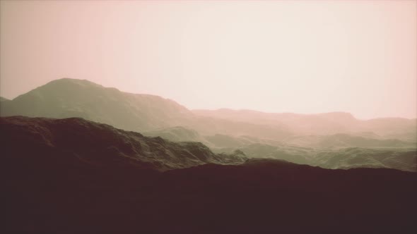 Silhouette of Swiss Alps Mountains in Morning Clouds