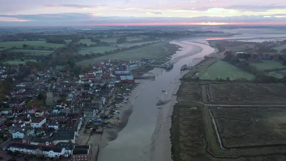 A sunrise flight along the River Colne between Wivenhoe and Rowhedge in Essex at sunrise with mist.