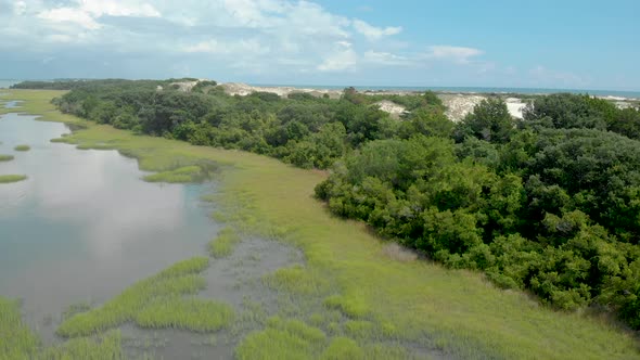 drone shots of the sand dunes and marsh lands at the coast