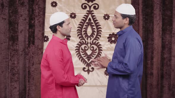 Two muslim man talking