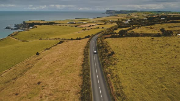 Aerial Autumn Road: Car Travel View. Beautiful Northern Ireland Countryside Nature Scene