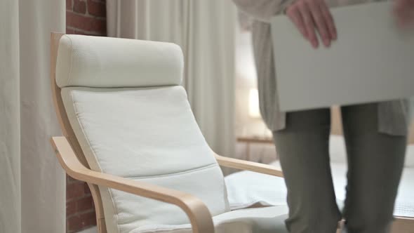 Old Woman Coming and Sitting on Sofa 