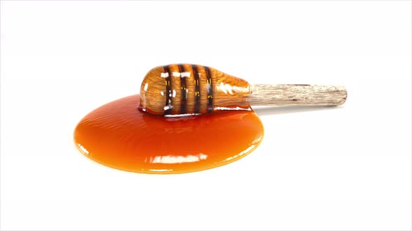 Honey dripping on sticky honey wood alt
