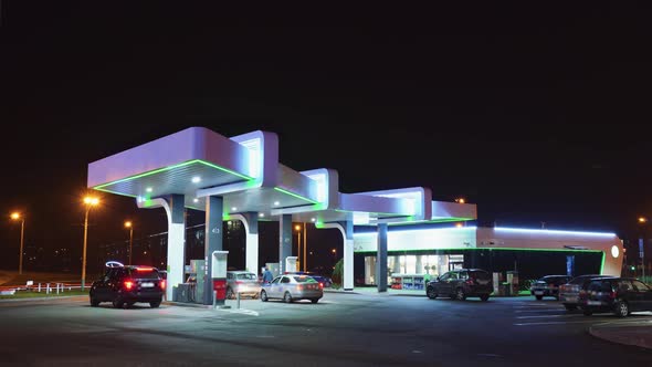 Timelapse of a gas station at night.