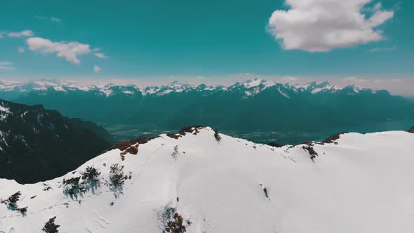 Aerial Drone View on Snowy Peaks of Swiss Alps. Switzerland. Rochers-de-Naye Mountain Peak.