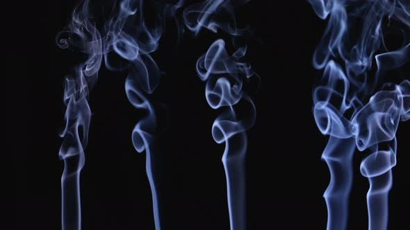 White Smoke Floating in Space on a Black Background in Slow Motion