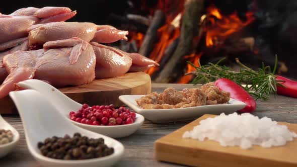 Panorama of the Ingredients for Grilled Quails on the Background of an Open Fire