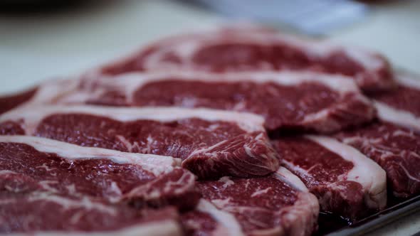 raw beef before grilling rosemary and garlic