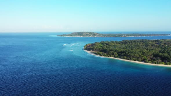 Aerial top down landscape of tranquil resort beach break by blue sea with white sand background of a