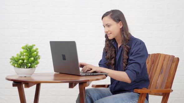 Indian girl relaxes after finshing up a work