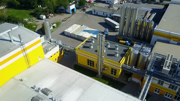 Aerial view of warehouse with trucks. Industrial background. Logistics from above