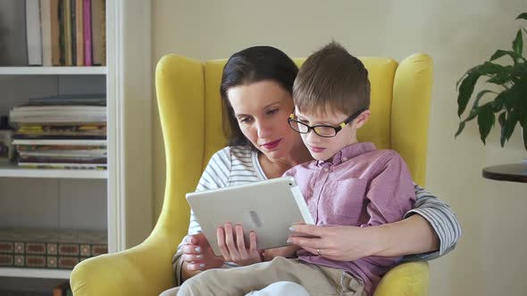 Mom and Cute Little Son Using Tablet at Home Spbd