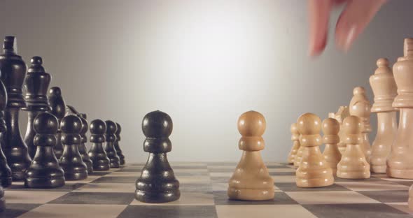 Special tracking macro shot moving between chess pieces on a chess board