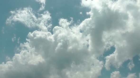 Fluffy Slowly  Clouds On The Blue Sky