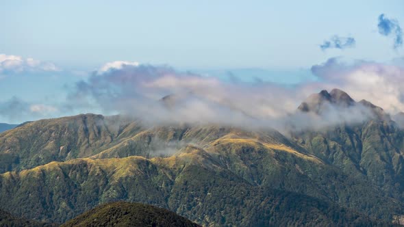 Clouds over Mountains Ridge in Tararua Range Forest Park in New Zealand