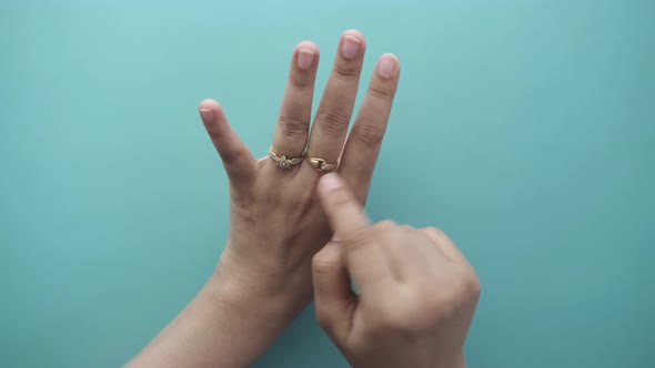 Close Up of Women's Hands with Wedding Ring