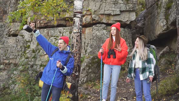 Enthusiastic Happy Tourists on Mountains or Rocks