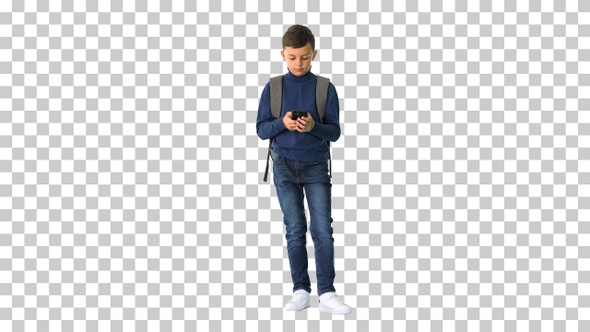 Schoolboy with a backpack using mobile phone, Alpha Channel