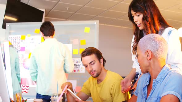 Creative business team working together at desk