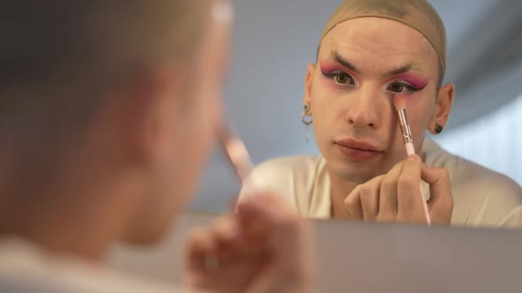 Closeup Reflection of Positive Queer Woman Applying Makeup Smiling Grimacing Admiring Result