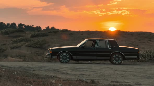 sunset and classic vehicle