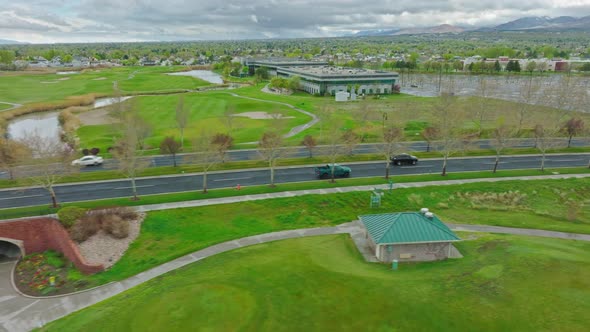 Aerial with a Cloudy Day over Lake Park Boulevard in West Valley City Utah - Lateral and Tilt Up Mov