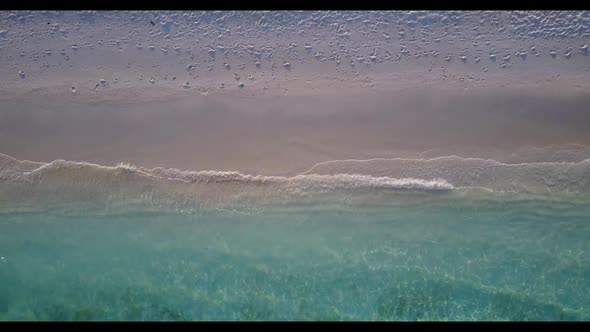 Aerial drone shot scenery of luxury lagoon beach journey by blue lagoon and white sand background of