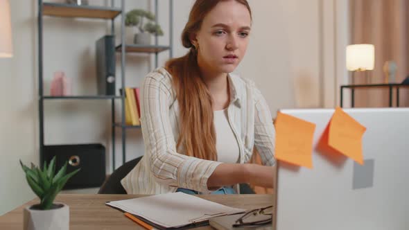 Nervous Adult Freelancer Girl Confused By Big Routine Laptop Work Loading Indoors at Home Office