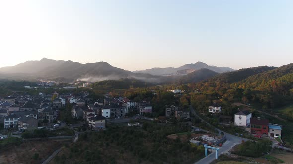 Mountain village and farmland in the sunset